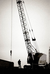 1962, a crane driver takes a break for a fag in Silvertown by John Claridge 1962, a crane driver takes a break for a fag in Silvertown by John Claridge